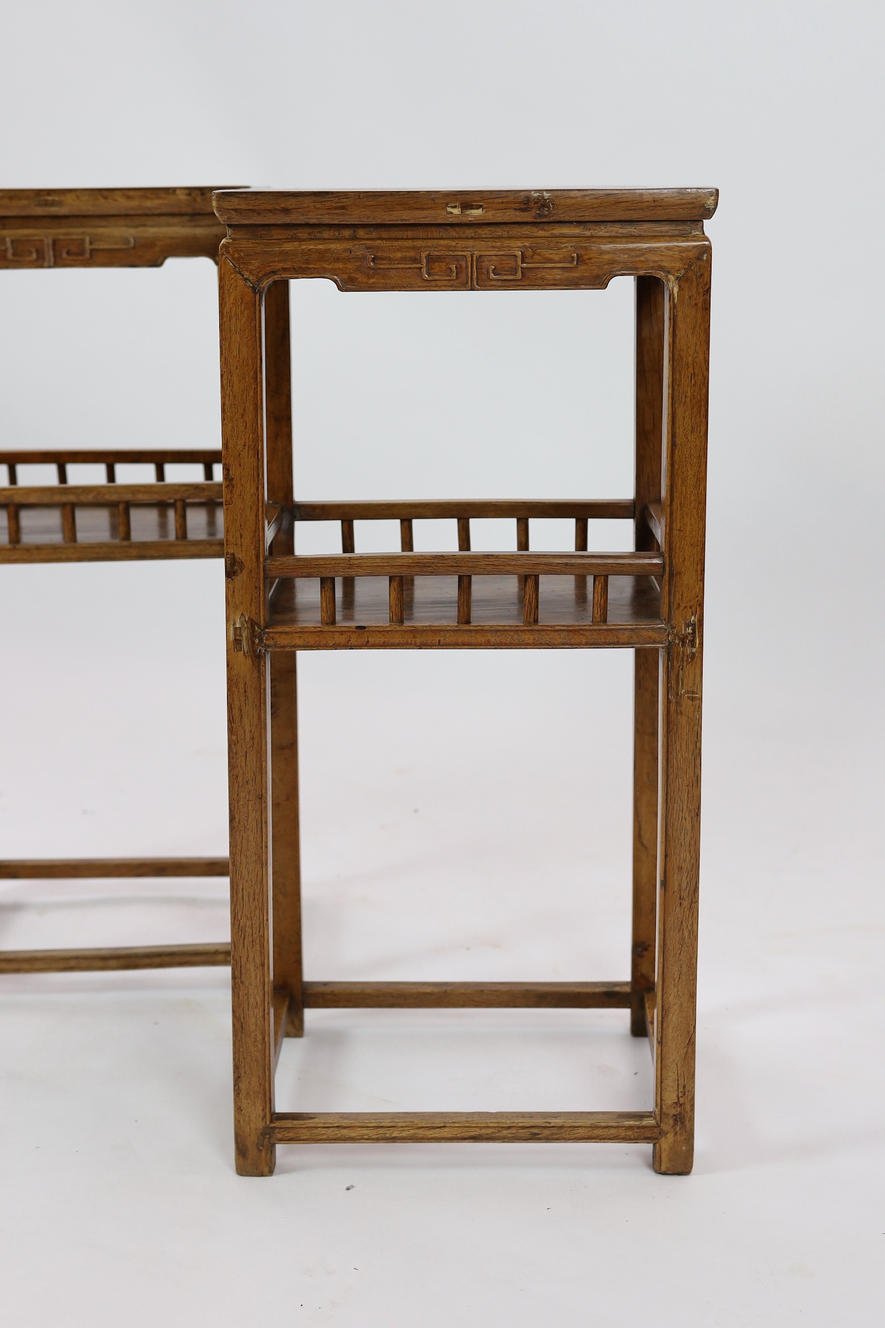 A pair of Chinese elm incense stands, 19th century, 39cm wide, 83.5cm high, 30cm deep